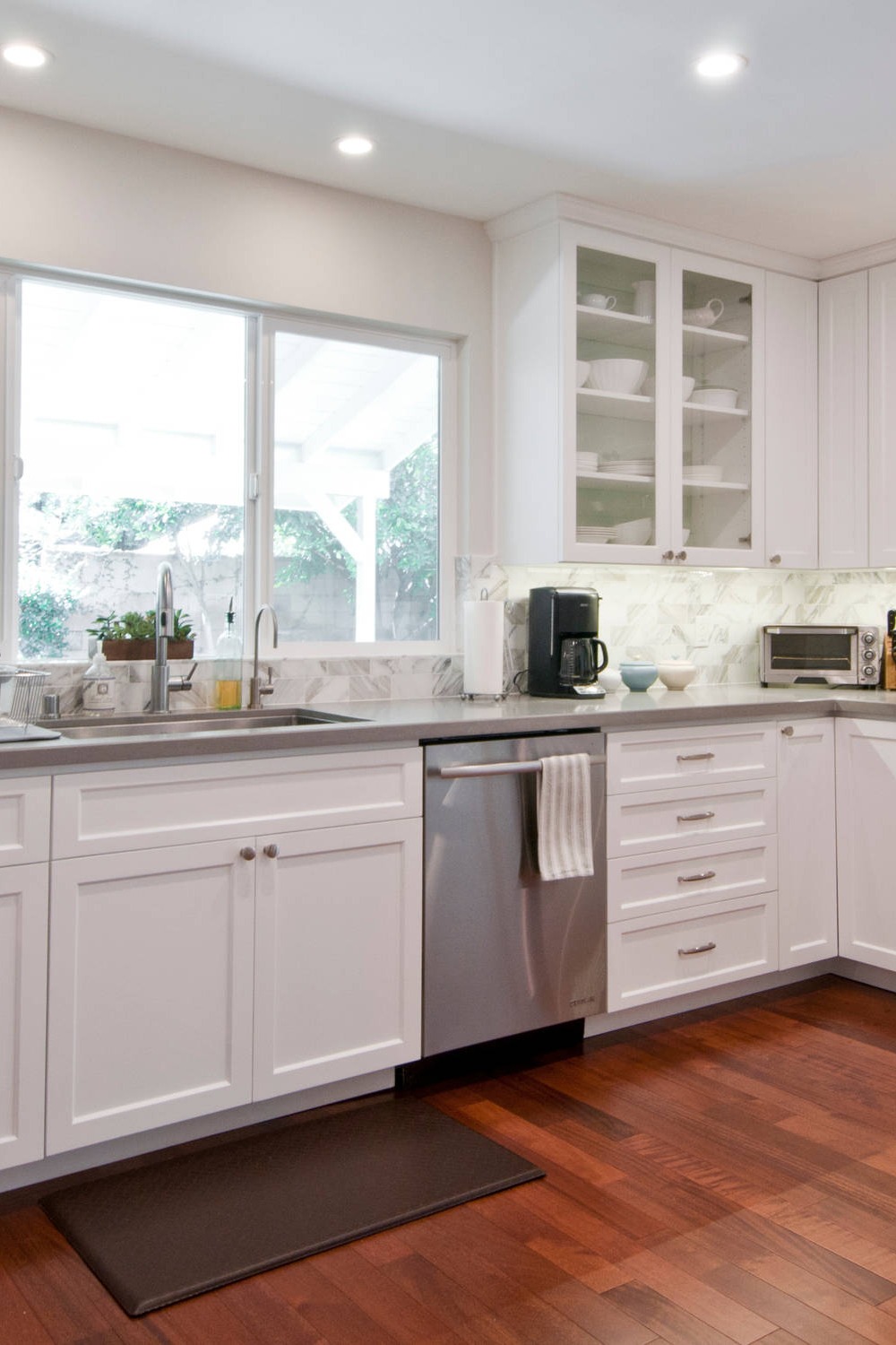 Wood Cabinets Kitchen Backsplashes Chevron Pattern Brass Accents Backsplash Design Gray Quartz Countertop
