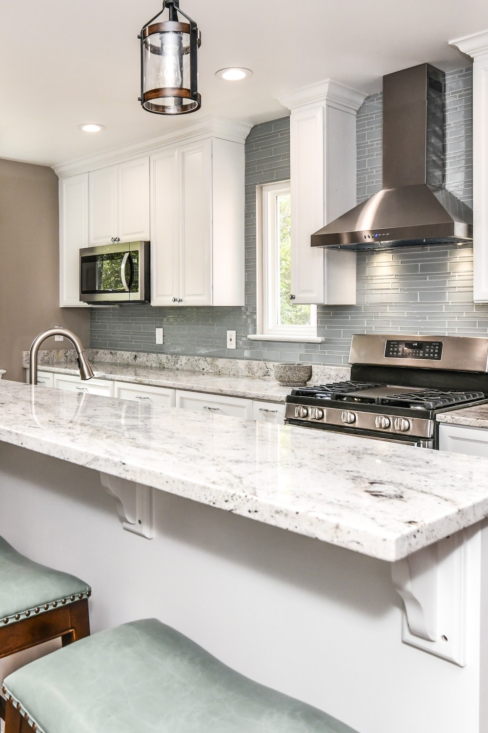 Glass Tiles Backsplash Glass Tile Granite Countertops Hood Raised Bar Top White Cabinetry