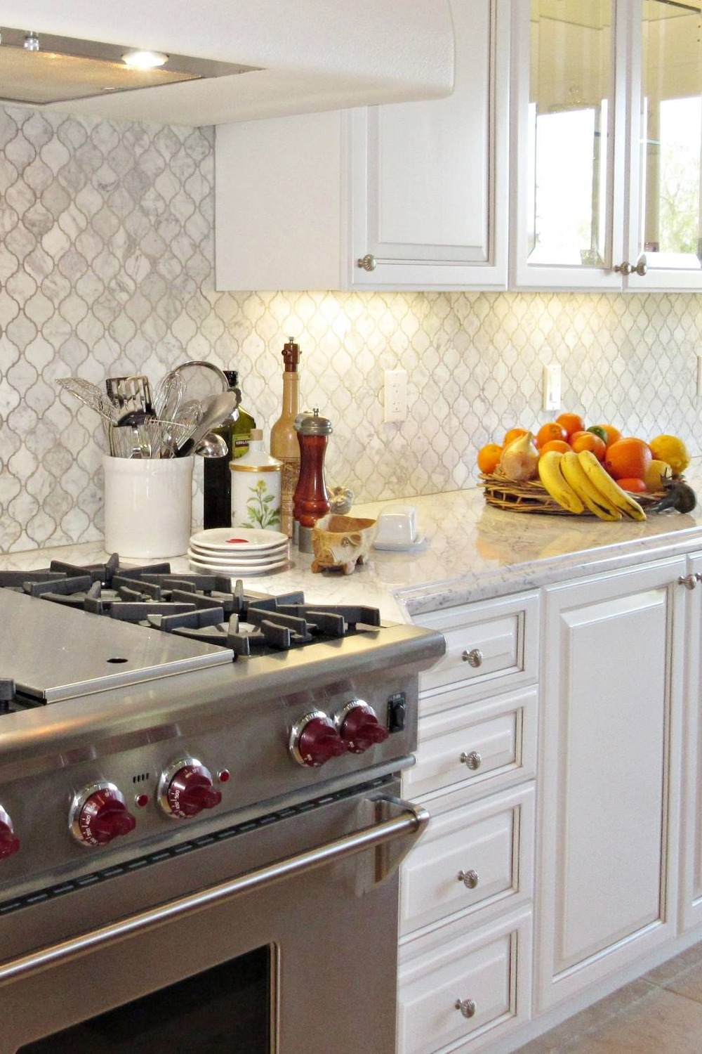 White Arabesque Tile White Kitchen Cabinets White Stone Countertops Grey Appliances Shaped