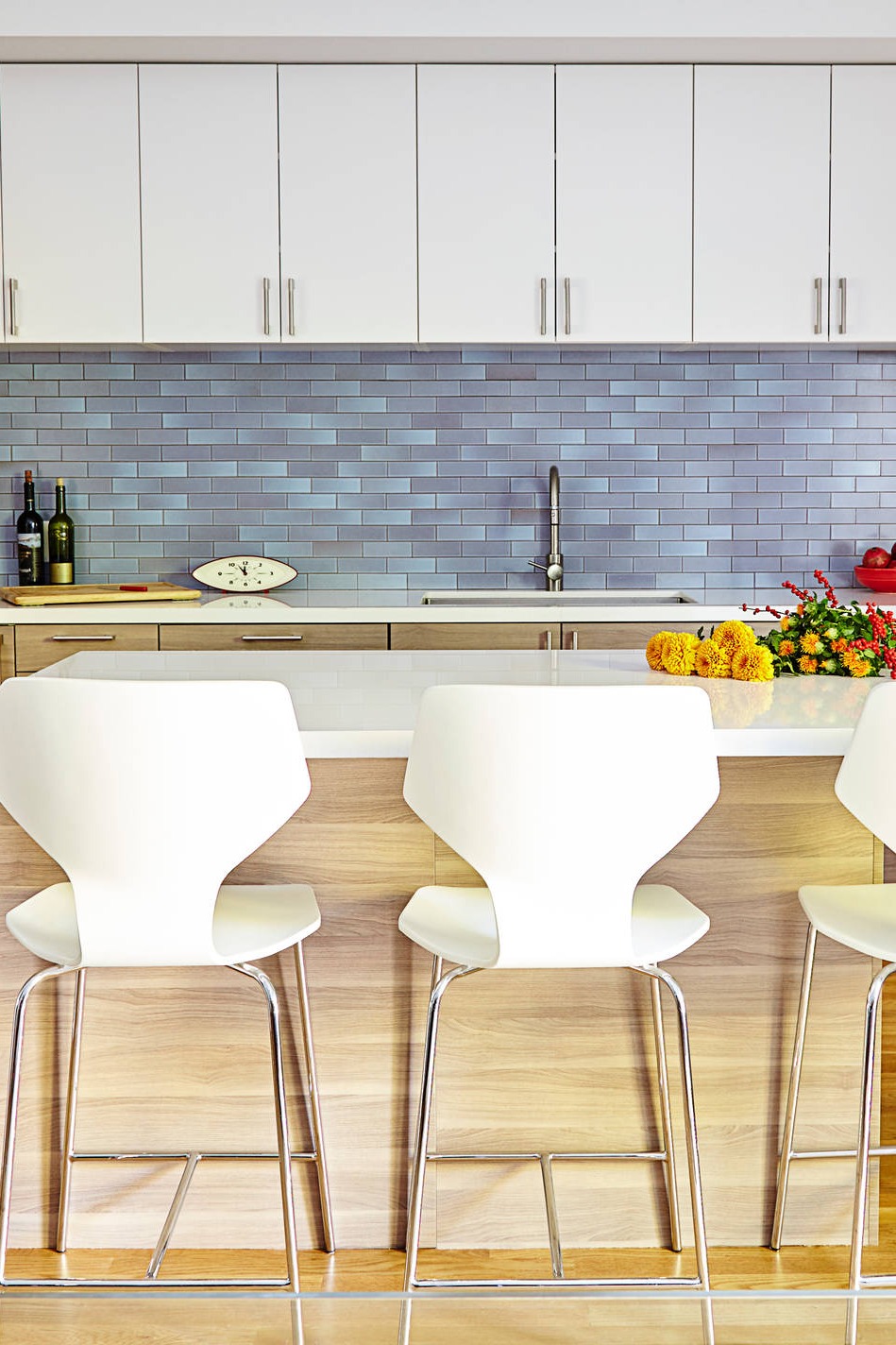 White Quartz Countertops Undermount Sink Blue Kitchen Brass Hardware White Cabinetry Clean Lines Kitchen Design Blue Tiles