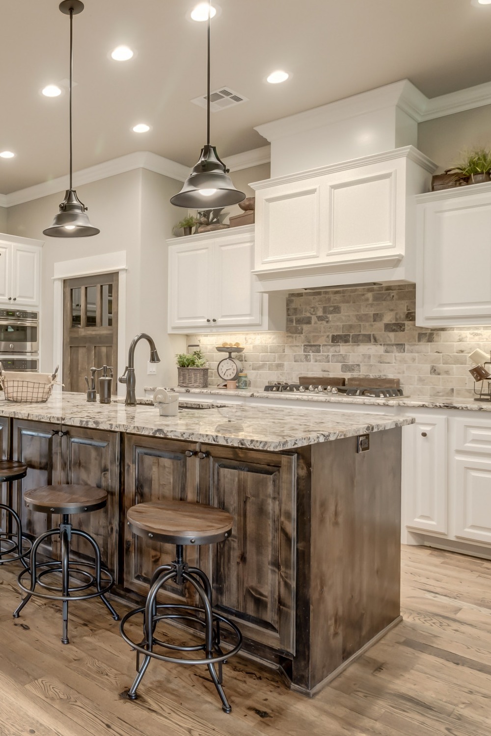 White Brick Backsplash White Cabinets Granite Countertops Wood Accents Rustic Charm Wooden Hood Modern Industrial Look Kitchen Style