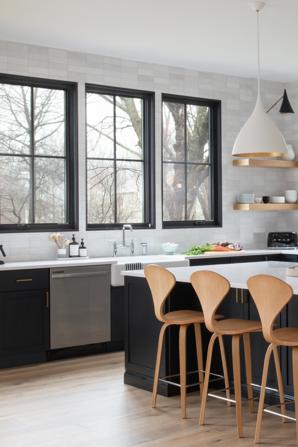 Dark Countertops Light Wood Floors No Upper Cabinets Paneled Appliances Modern Kitchens