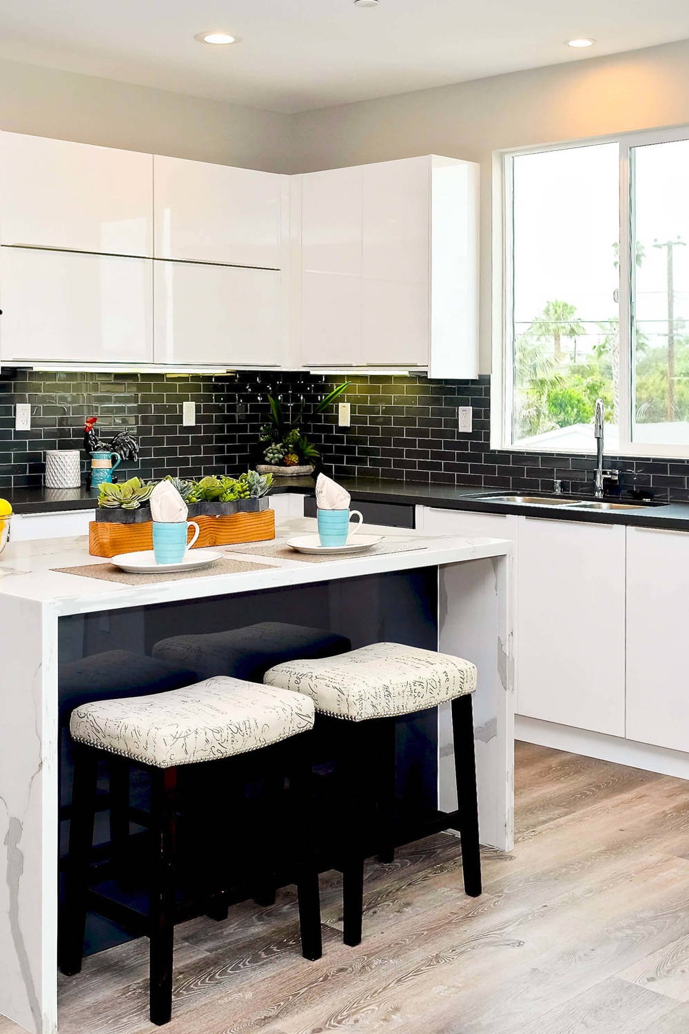 White Cabinets And Black Countertop Eat In Kitchen Island Ceramic Backsplash Granite Countertops White Cabinetry