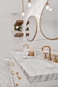 Re Bath Bathroom Remodel Shower Tile Brass Fixtures Marble Countertop Shelves Round Mirror